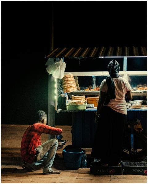 Street food stall in Colombo at night, offering lo