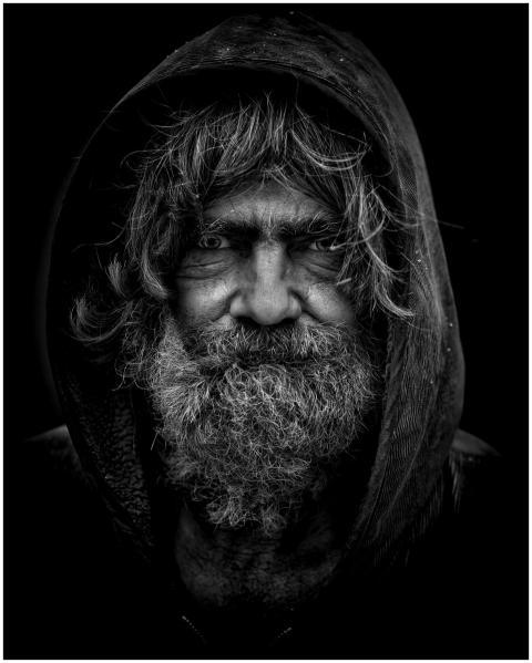Emotive black and white portrait of an elderly man