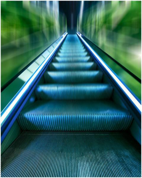 A vibrant, futuristic view of an escalator capture