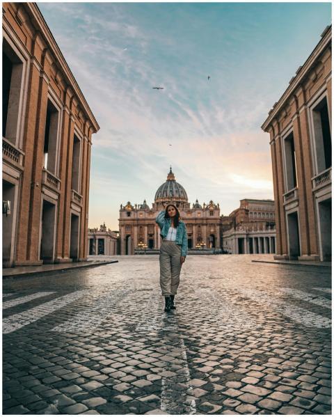 Full length of young female tourist standing again