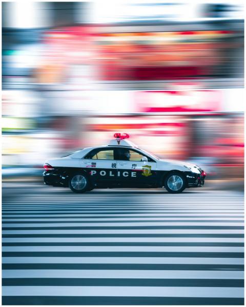 A Tokyo police car speeding through the city stree