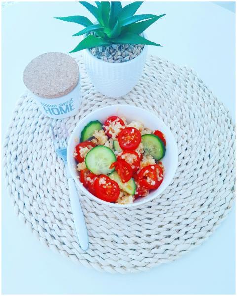 Bright vegan salad with quinoa, cucumbers, and tom