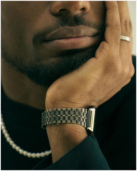 Close-up of a thoughtful bearded man resting his c