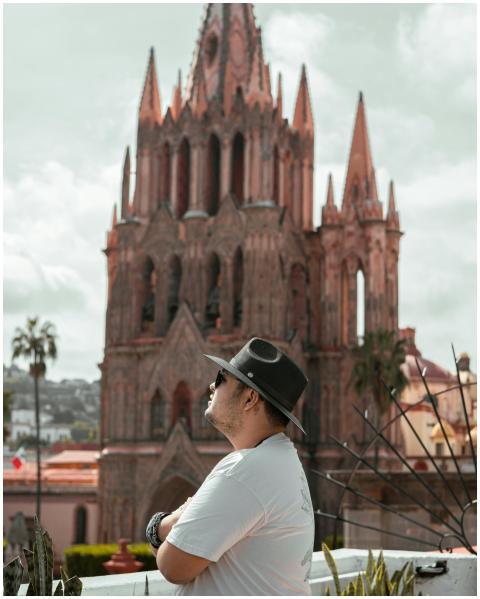 A man in a hat gazes at the stunning architecture