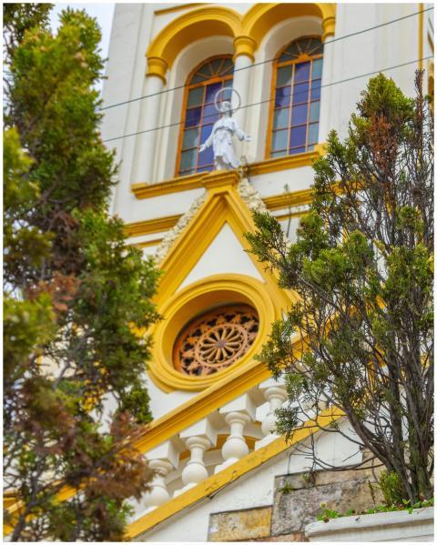 A detailed view of a historic church facade with t