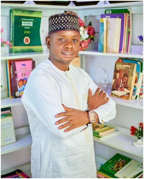 Young man in traditional clothing stands confident