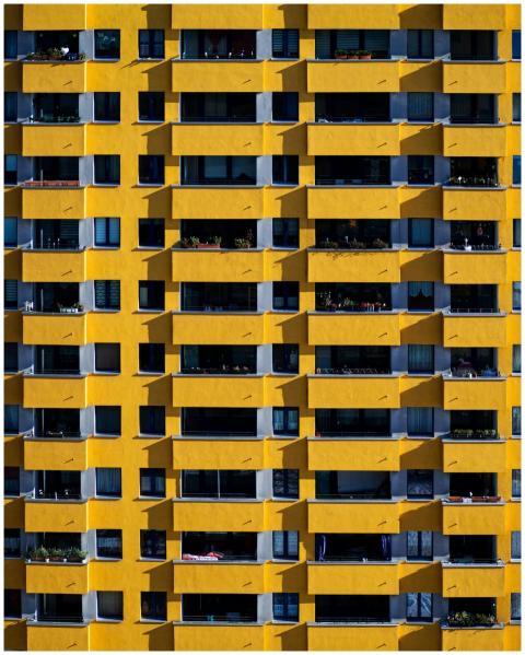Vibrant yellow apartment building facade in Berlin