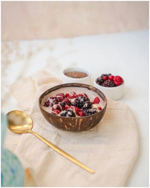 A vibrant berry smoothie bowl adorned with fresh b