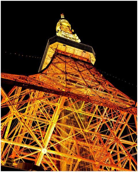 Dramatic view of Tokyo Tower illuminated at night,