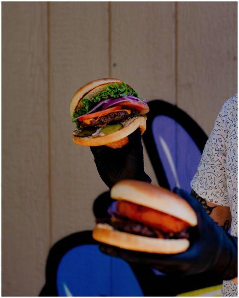 Vertical shot of a tasty burger stack with fresh v