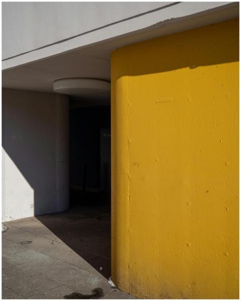 Stylish urban architecture with a vibrant yellow w