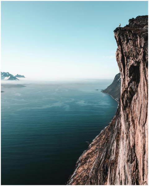 A breathtaking view of a towering cliff overlookin