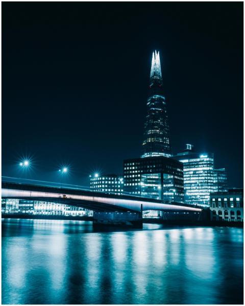 A captivating nighttime cityscape featuring The Sh