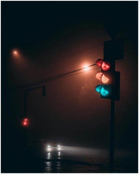 Automobile with glowing headlights on road near il