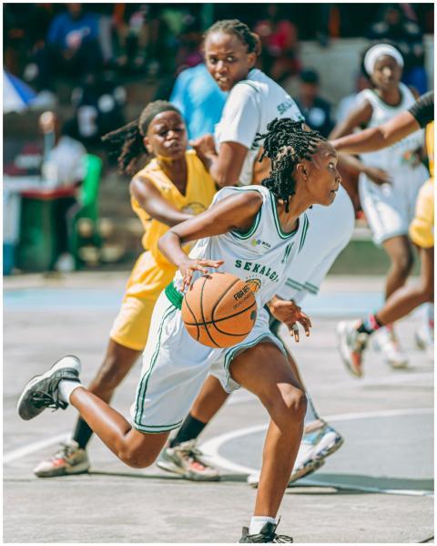 Dynamic image of women playing competitive basketb