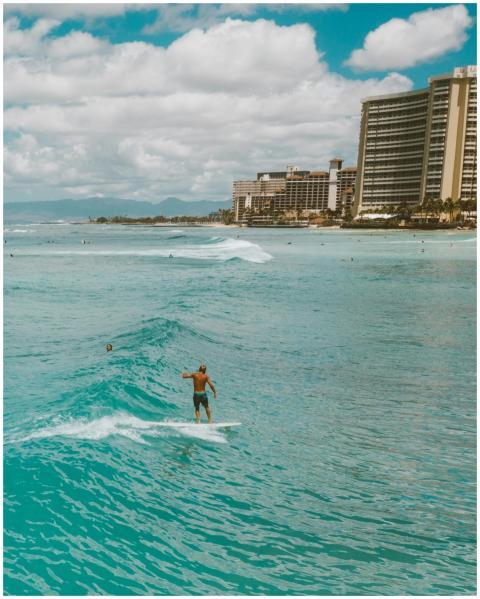 Exciting surf scene with a surfer skillfully ridin