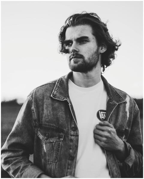 Artistic black and white portrait of a man in deni