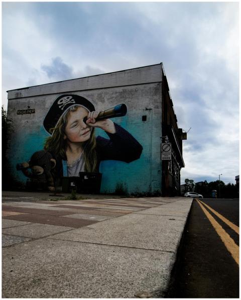 Vibrant street art of a pirate child on a building