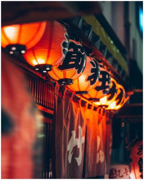 Illuminated Japanese lanterns casting a warm glow