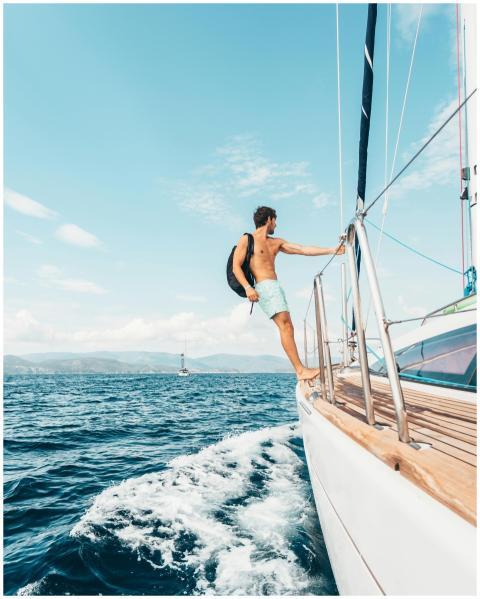 A man enjoys sailing on the Aegean Sea, showcasing