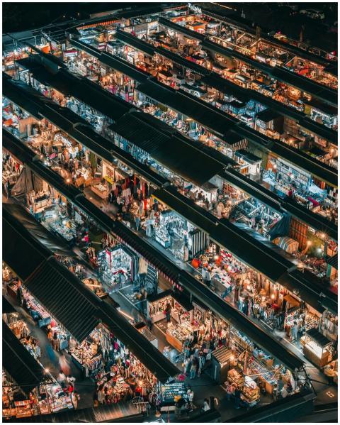 A bustling aerial view of a vibrant night market i