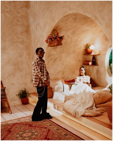 A warm, inviting indoor space with two people rela