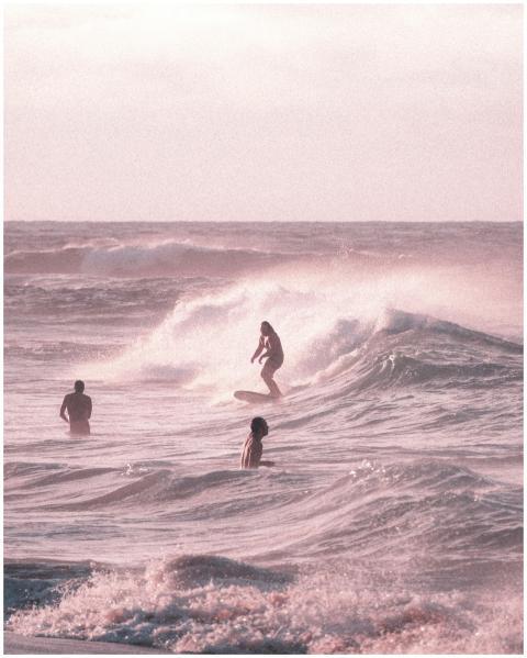 Surfer catching waves at a picturesque beach with