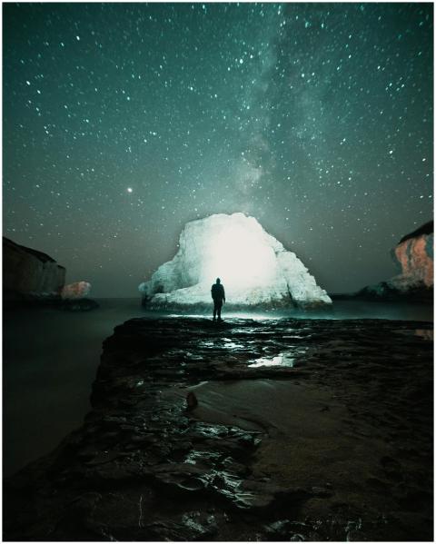 Stunning nightscape of a person silhouetted agains