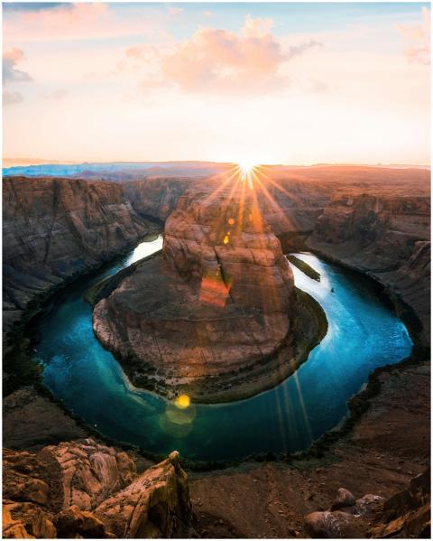 Stunning sunset at Horseshoe Bend with sunburst ov