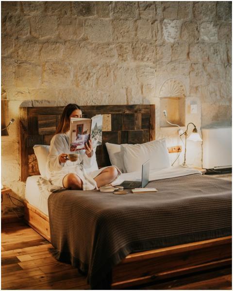 Woman relaxing in a cozy hotel room in Ürgüp, Türk