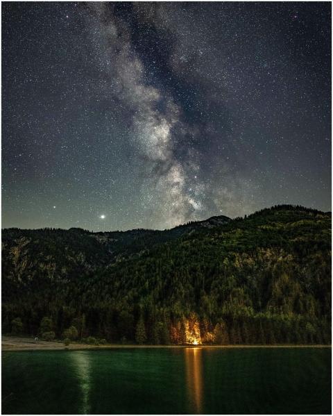 A breathtaking view of the Milky Way over a serene