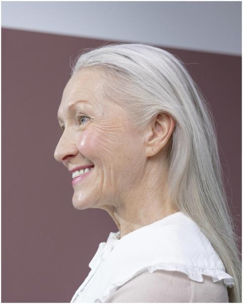 Portrait of a senior woman with gray hair, smiling