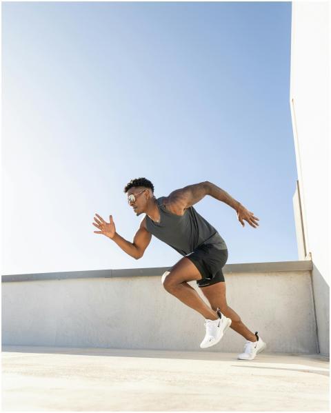 Energetic athlete running on a rooftop in Austin w