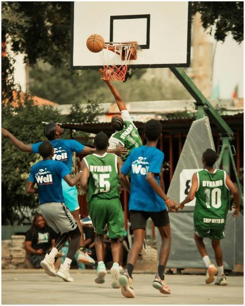 Dynamic street basketball game with players making