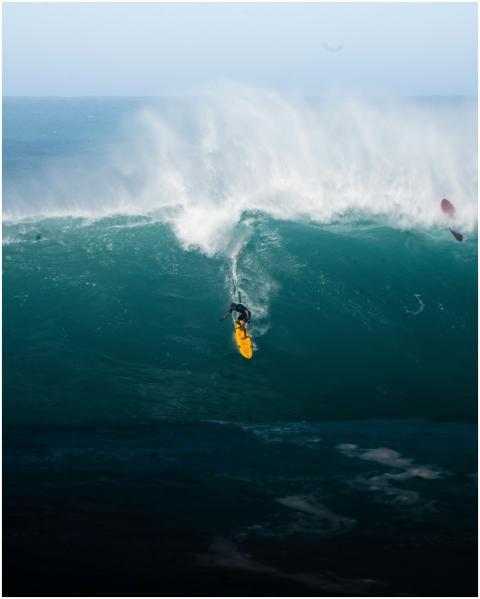 Catch the intense moment of a surfer mastering hug
