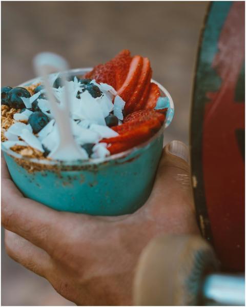 Close-up of a vibrant acai bowl topped with strawb