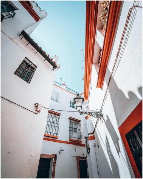 Low angle view of white buildings with orange trim