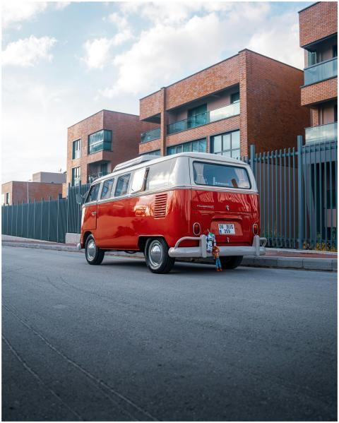 Vintage red Volkswagen van parked on a street in A
