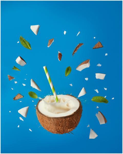 Dynamic image of a coconut drink with pieces and l