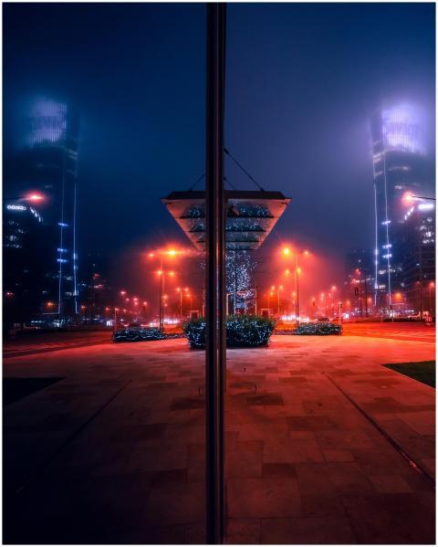A mystical urban scene in Warsaw, Poland, with glo