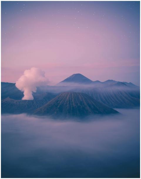 A picturesque view of Mount Bromo surrounded by mi