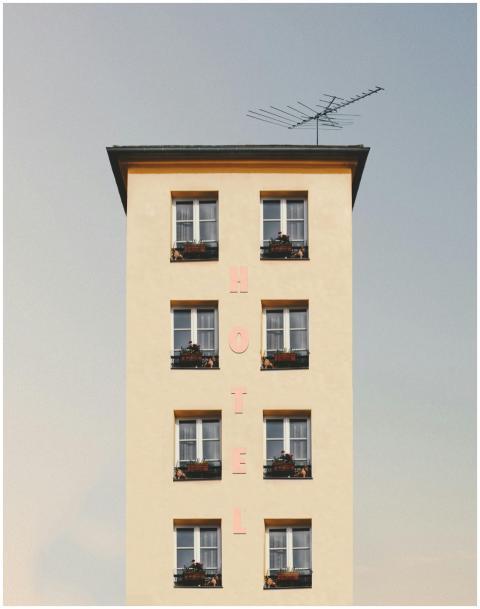 A minimalist hotel facade showcasing clean lines,