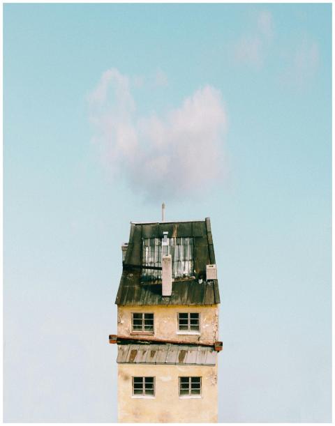 A minimalist photograph of a tall, simple urban to