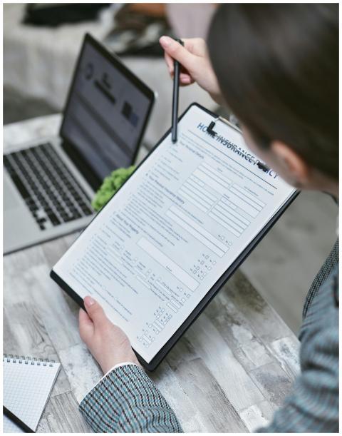 An adult reviews a home insurance policy document