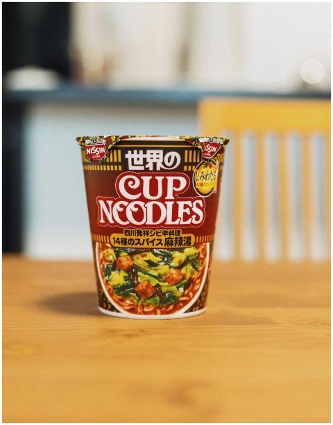 Close-up of Nissin cup noodles on a table in Tokyo