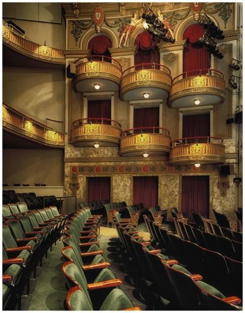 Classic theater interior featuring ornate balconie