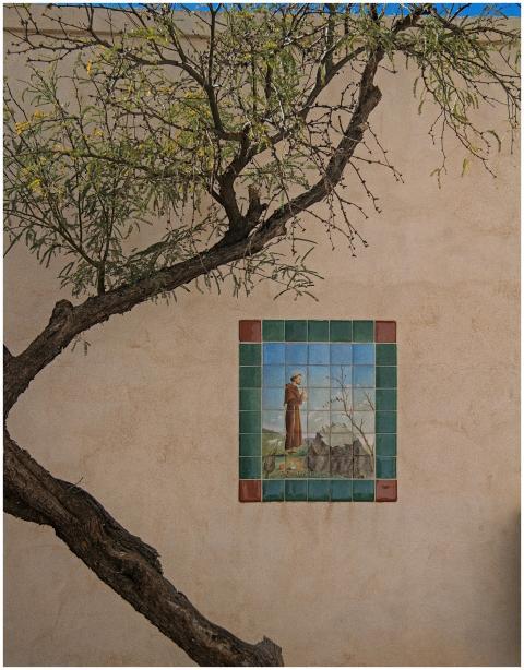 Tile art depicting a saint, located on a mission w