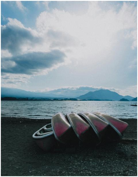 Dramatic view of Lake Kawaguchi with stacked canoe