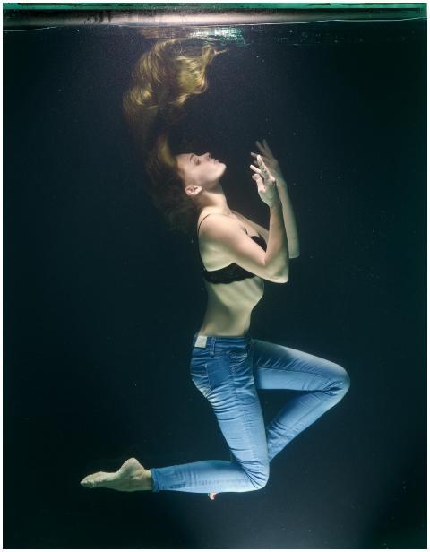 Stunning underwater portrait of a woman in motion
