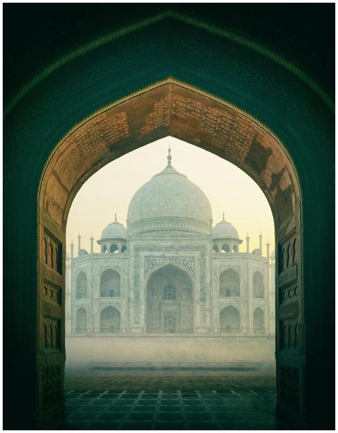 The iconic Taj Mahal viewed through a historic arc